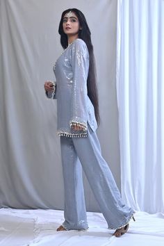 Grey short kurta with a sequin embellished base highlighted by placed pearl and jewel detail. Comes with matching sequined bell bottom pant and dupatta. - Aza Fashions Bollywood Sequin Pant Set For Party, Bollywood Style Sequined Party Pant Set, Bollywood Sequin Party Pant Set, Bollywood Style Sequined Pant Set For Festive Occasions, Elegant Designer Sequin Pant Set, Elegant Sequined Designer Pant Set, Traditional Party Pants With Mirror Work, Traditional Embellished Bottoms For Party, Elegant Sequin Pant Set