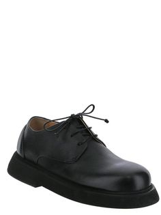 Marsell lace-up shoe in black leather with oversized sole and round toe Platform Lace-up Shoes With Round Toe For Derby, Formal Closed Toe Oxfords With Vibram Sole, Black Oxfords With Lug Sole And Plain Toe, Black Plain Toe Oxfords With Lug Sole, Leather Platform Oxfords For Derby, Platform Leather Oxfords For Derby, Black Lace-up Shoes With Lug Sole For Formal Occasions, Formal Platform Oxfords With Round Toe, Derby Lace-up Shoes With Leather Sole And Flat Heel