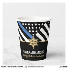 a paper cup with an american flag and police insignia on the side that says congratulations sheriff michael smith