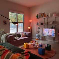 a living room filled with furniture and a flat screen tv