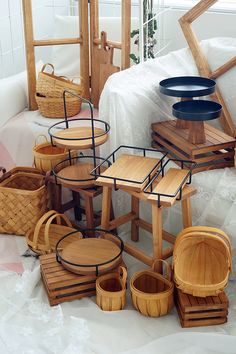 several wooden chairs and tables on display in a room