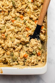 a casserole dish with chicken and vegetables in it, ready to be eaten