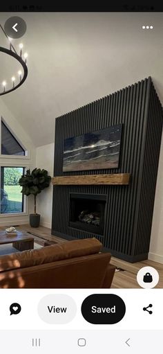 a living room filled with furniture and a fire place in front of a flat screen tv