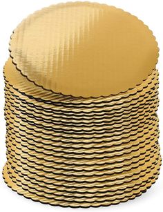 gold foiled round cake plates stacked on top of each other with scalloped edges