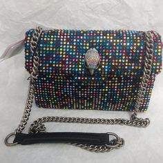 Kurt Geiger Kensington Medium Lite Bright Rainbow Rhinestone Crossbody Bag  100% Authentic From Kurt Geiger London ,From Kurt Geiger London, the Kensington Medium Lite Bright Rainbow Rhinestone Crossbody Bag features:  Polyester exterior Silver hardware Flap closure Polyester lining Slash pocket Eagle head detail Stone detail Single strap Approx. 8.66" W x 6.29" H x 3.14" D bag; 23.62" strap drop  Kurt Geiger Dust bag included If a buyer needs to return an item, it must be returned in the same condition in which it was received, and it must include all items that were in the original package. Tag attached and no links removed on watches.If the returned item is missing any parts, or is damaged during return shipping because it wasn't packaged correctly, we can deduct the amount of loss and Evening Shoulder Bag With Rhinestones Crossbody, Trendy Rhinestone Crossbody Shoulder Bag, Evening Rhinestone Crossbody Shoulder Bag, Top Handle Shoulder Bag With Rhinestones For Everyday, Trendy Rhinestone Crossbody Bag, Party Crossbody Shoulder Bag With Rhinestones, Evening Rhinestone Crossbody Bag, Party Rhinestone Crossbody Shoulder Bag, Luxury Multicolor Bag With Chain Strap