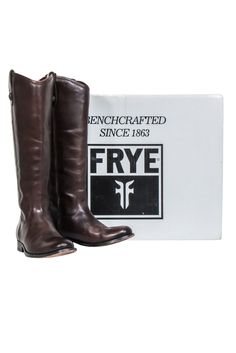 Frye's "Melissa Button" tall boots are the perfect fall staple for chilly days. Made of dark brown leather, these stylish boots style perfectly with a soft knit for ultimate coziness. Get ready to rock your style with these classic yet trendy boots! Size 5.5 100% Leather Pull on Side button loop detail Shaft 15" Circumference 14.5" Toe to heel 9.75" Rugged Brown Knee-high Boots For Fall, Classic Brown Knee-high Boots For Winter, Brown Snip Toe Knee-high Boots For Fall, Brown Snip Toe Knee-high Boots For Winter, Trendy Boots, Fall Staples, Boots Style, Buy Shoes Online, Stylish Boots