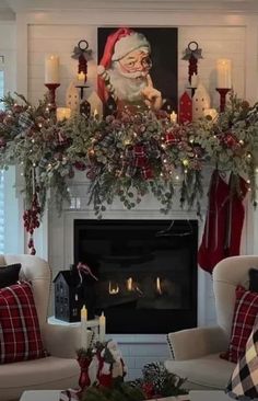 a living room decorated for christmas with candles and stockings on the fireplace mantels