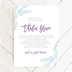 a white and blue wedding card with the words thaua grace written in purple ink