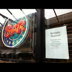 the sign for bar b - q is displayed on the window