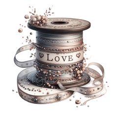 a spool of thread with the word love on it and some beads around it