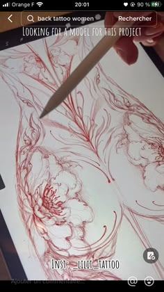 someone is using a tablet to draw flowers and leaves on the paper with a knife