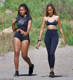 two women walking down the road together