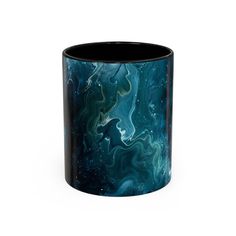 a black and blue marbled coffee mug on a white background