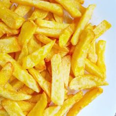 french fries on a white plate ready to be eaten