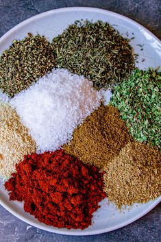 a white plate topped with different types of spices