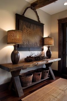 a wooden table with two lamps and baskets on it in front of a door way