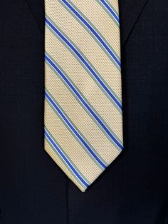 A general all around great tie to wear with any suit, shirt for any occasion. With two different types of silk in the same necktie, the stripe being satin and the broad section being woven, this tie makes an all day knot that does not have to be readjusted. With colorations of kelly green and blue stripes, you cannot make a mistake creating a look with this tie pairing with any suit in your closet. Green With Blue, Suit Shirt, Kelly Green, Silk Ties, Necktie, Different Types, Blue Stripes, Neck Tie, Knot