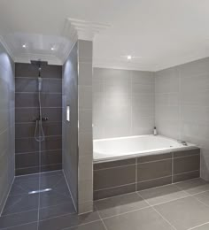 a bathroom with a walk in shower next to a white bath tub and tiled walls