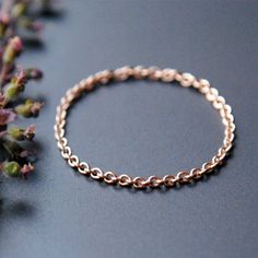 This dainty beauty is crafted from solid 14k Gold cable chain. A perfect wedding ring, knuckle ring, thumb ring it also makes for a lovely piece of jewelry to gift to your bridesmaids and BFFs. SIZING: Since it is a chain ring, WE SIZE HALF A SIZE UP on the ring size you select. Please select your actual ring size. Note: Chain rings tend to stretch with time. Avoid Each ring is hand crafted, finished and made to order. Hence, they may have slight variations. These aren't flaws, they add to the u Tragus Gold, Gold Chain Ring, Dainty Wedding Band, Dainty Wedding, Gold Stacking Ring, Gold Rings Simple, Yellow Gold Wedding Band, Tragus Earrings, Solid Gold Chains