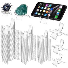 several pieces of plastic are arranged next to an iphone