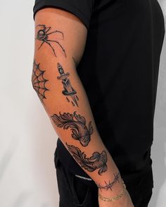 a man with a spider tattoo on his arm