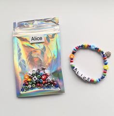 DIY stretchy bracelet kit.   Fun bracelet to make for yourself or for a friend. Comes packaged in a holographic gift bag with your chosen name or word on the outside.  Fun bracelet kit to either make for yourself or give to a friend either completed or in kit form, if they would like to make it themselves.  Personalise the bracelet with with a name or word of your choice The beads come in an holographic bag so once the bracelet is made it can go back in the bag ready for gifting.  Full instructions are included. A special bracelet kit for a special friend which they can make and wear with pride and feel happy when they see these beautiful colours on their arm! Feel happy when wearing this bracelet with its personalised name or word and colourful beads. The kit also includes a with love cha Personalized Multicolor Bracelets For Gift Making, Multicolor Personalized Bracelets For Gifts, Personalized Multicolor Bracelets As Gift, Personalized Multicolor Bracelets For Gifts, Handmade Multicolor Name Bracelet For Gift, Handmade Multicolor Name Bracelet As Gift, Personalized Multicolor Name Bracelet As Gift, Playful Multicolor Name Bracelet For Gifts, Playful Multicolor Name Bracelet Gift