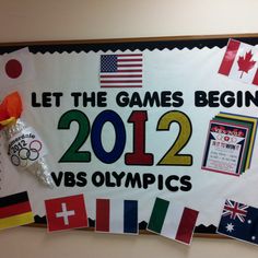 a bulletin board with olympic symbols and flags on it that says let the games begin 2012 vbs olympics