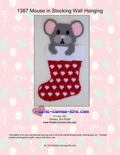 a cross stitch christmas stocking with a mouse in it's boot and the text,