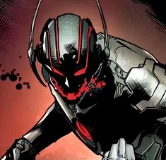 an ant - man character with red and black paint on his face, standing in front of a red background