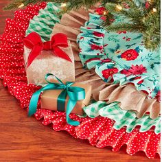 a christmas tree skirt with presents on it