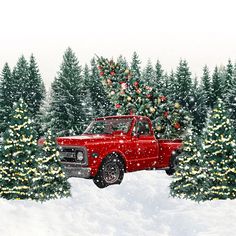 a red truck parked next to a christmas tree in the snow with lights on it