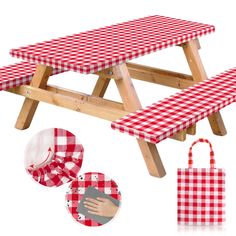 a picnic table with red and white checkered cloth on it, next to two bags