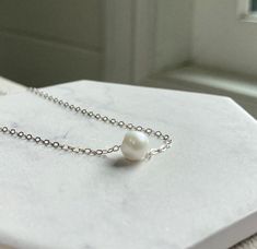 This listing is for one gorgeous necklace, featuring a floating white pearl. * Pearl is an off-white shade and measures 8mm. Please note this is not considered a "perfect" pearl! It is very beautiful.  * The necklace is 14" and is made of a dainty sterling silver cable chain, with a 3"extender chain so the length is customizable between 14"-17". It is finished with a sterling silver spring ring clasp.  _ _ _ _ _ _ _ _ _ _ _ _ _ _ _ _ _ _ _ _ _ _ _ _ _ _ _ _ _ _ _ _ _ _ _ _ _ _ _ _ _ _ _ _ _ _ _ White Pearl Necklace, Bead Pendant, June Birthstone, Silver Spring, June Birth Stone, Gorgeous Necklaces, Beaded Pendant, Sterling Silver Chain, White Pearl