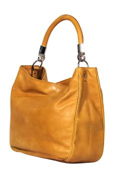 Add some warm tones to your autumn style with this bag from Yves Saint Laurent! Made with smooth leather in an autumn-inspired mustard hue, this statement beauty from the iconic French fashion house is perfect for pairing with all your seasonal favorites! From apple picking to leaf peeping and everything in between, pair this with an oversized flannel and your favorite jeans and you'll be all set for your chilly weather adventures! Leather Silver-toned hardware Top carrying handle Top snap butto Ysl Purse, Leaf Peeping, Yellow Handbag, Oversized Flannel, Apple Picking, Autumn Style, Fashion House, Leather Silver, Autumn Inspiration