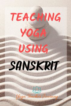 the words teaching yoga using sanskirt on top of sand with rocks in it