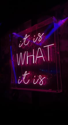 a neon sign that says it is what it is