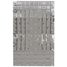 a metal wall with lots of silver boxes on it