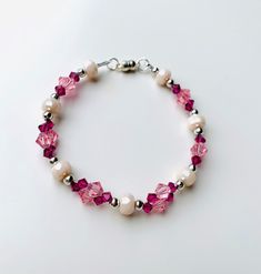 Swarovski crystals are well known for the brilliant colors that catch light from all directions. This bracelet is made of brilliant 6mm rose pink and 4mm dark fushia bicone crystals with accent beads.   All items are handmade in the USA with care and attention to detail. Free shipping to anywhere in the US with purchase of $35 or more. Pink Crystal Beaded Round Bracelets, Elegant Pink Faceted Crystal Bracelet, Pink Crystal Bracelets With Round Beads, Pink Crystal Bracelets With Faceted Beads, Pink Faceted Crystal Bracelet Gift, Pink Faceted Crystal Bracelet For Gift, Elegant Pink Hypoallergenic Beaded Bracelets, Adjustable Pink Faceted Crystal Bracelet, Elegant Pink Hypoallergenic Bracelet