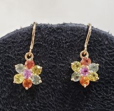 1. 14k Gold Multi Sapphire Earring 2. Stamped 3. Gemstone - Multi Sapphire 4. Jewelry Type - Earring 5. Total Weight - 2.430 Gram Approx. 6. Multi Sapphire Weight - 1.80 Carats Approx. 7. Multi Sapphire Size - 3 MM Approx.  8. Gold Weight - 2.070 Grams  9. Gold Purity - 14k 10. Shape - Flower  11. Ready to Dispatch in 1 - 2 days. 12. Handmade Items 13. AAA Quality Earring 14. 1 Pair Available  Pictures are taken under natural and day light. Yellow Gold Multi-stone Drop Earrings, 14k Gold Multi-stone Drop Earrings, Sterling Silver Multi-stone Yellow Gold Earrings, Yellow Gold Sterling Silver Multi-stone Earrings, Yellow Gold Multi-stone Sterling Silver Earrings, Women Gold Jewelry, Sapphire Earring, Gold Hooks, Minimalist Earring