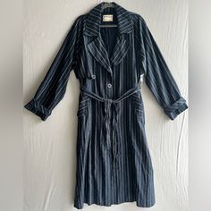 Free People We The Free Melia Mac Pinstripe Duster Trench Coat Size M Navy And White Pinstripes Linen Cotton Blend Midway Button Front Ankle Duster Length Notch Collar Front Pockets Strap Button Cuff Detail Oversized Slouchy Fit Matching Tie Waist Belt Extra Buttons Unlined New Without Tags Armpit To Armpit 24.5”-25” Length Shoulder To Hem 50” Spring Pinstripe Outerwear With Pockets, Striped Single-breasted Outerwear For Fall, Striped Single Breasted Outerwear For Fall, Single Breasted Striped Outerwear For Fall, Casual Pinstripe Outerwear For Fall, Pinstripe Long Sleeve Outerwear For Fall, Spring Pinstripe Long Sleeve Outerwear, Chic Striped Outerwear With Button Closure, Spring Outerwear With Vertical Stripes And Long Sleeves