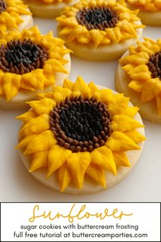 sunflower sugar cookies with buttercream frosting are arranged on a white surface