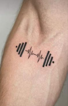 a heartbeat tattoo on the arm