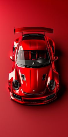 a red sports car is shown from above on a red background with the hood up