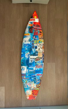 a surfboard is hanging on the wall