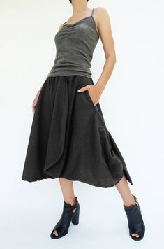 "🚚..ALL ORDERS ARE SHIPPED VIA DHL EXPRESS MAIL Treating every design as a piece of art, look no further than asymmetric midi skirt/pants. This special design skirt has one leg of pants. Asymmetric panelled construction. Wide elastic waistband. Tonal stitching. Asymmetric hem. * Pull-on style * 2\" elastic waistband * The skirt has one left leg of pants * Tonal stitching * Side seam pockets * Asymmetric hem * Unlined Measurements approximately: Waist: 26\" stretching to 46\" (66 cm-117 cm)-elas Chic Asymmetrical Cotton Bottoms, Avant-garde Asymmetrical Skirt For Spring, Cotton Asymmetrical Skirt With Pockets, Asymmetrical Cotton Bottoms For Fall, Casual Asymmetrical Cotton Bottoms, Asymmetrical Fitted Lined Skirt, Chic Asymmetrical Cotton Skirt, Asymmetrical Cotton Relaxed Skirt, Asymmetrical Maxi Skirt With Pockets