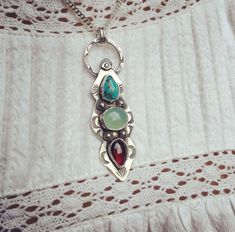 One off piece with beautiful turquoise, garnet and aqua chalcedony gem stones.  Southwestern style details. Hand crafted. Timeless pendant worn alone or layered. Bohemian Jewelry With Gemstone Pendant, Bohemian Jewelry Pendant With Gemstone Accents, Bohemian Jewelry With Gemstone Accents, Bohemian Multi-stone Pendant Jewelry, Bohemian Turquoise Pendant Necklace With Stones, Bohemian Multi-stone Jewelry, Bohemian Turquoise Multi-stone Pendant Necklace, Aqua Chalcedony, Southwestern Style