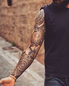 a man with a tattoo on his arm