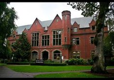 an old red brick building with many windows