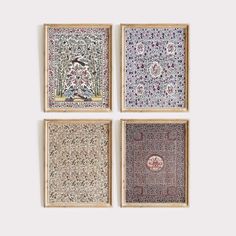 four framed artwork pieces in various colors and patterns, each with an animal on it