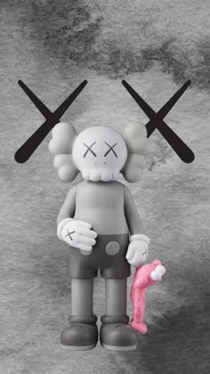 a cartoon character holding a pink object in front of two crossed black and white crosses